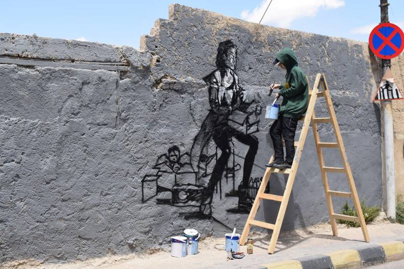 A street art work in progress on the streets of Amman. Courtesy Baladk Project