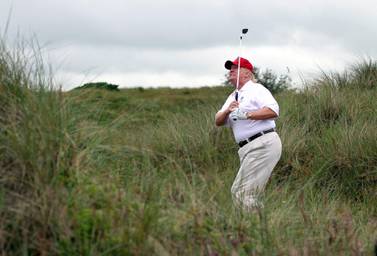 Donald Trump plays a round of golf at The Trump International Golf Links Course in Scotland. Getty Images
