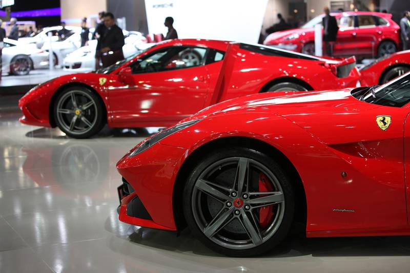 DUBAI , UNITED ARAB EMIRATES : Nov 05 , 2013 :- Ferrari cars on display in the Dubai International Motor Show held at Dubai World Trade Centre in Dubai. ( Pawan Singh / The National ) . For Weekend. Story by Carlin Gerbich *** Local Caption ***  PS0511- MOTOR SHOW41.jpg