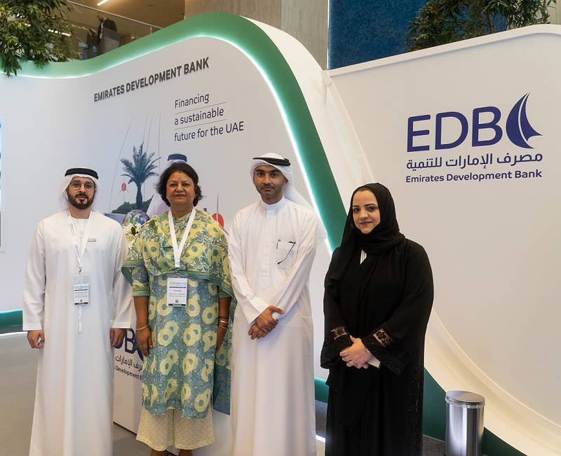 Ahmed Al Naqbi of Emirates Development Bank, left, and Gauri Singh of Irena, second left, at the alliance announcement. Photo: EDB