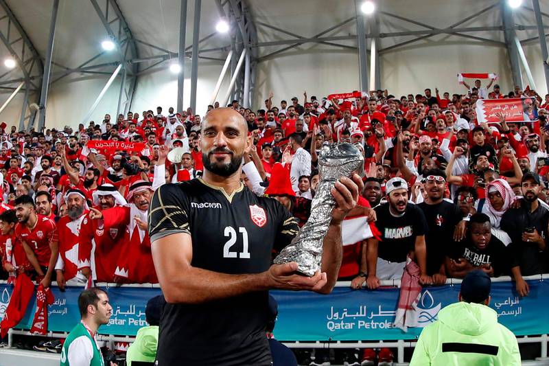 Bahrain'goalkeeper Sayed Jaffer poses with the trophy. AFP