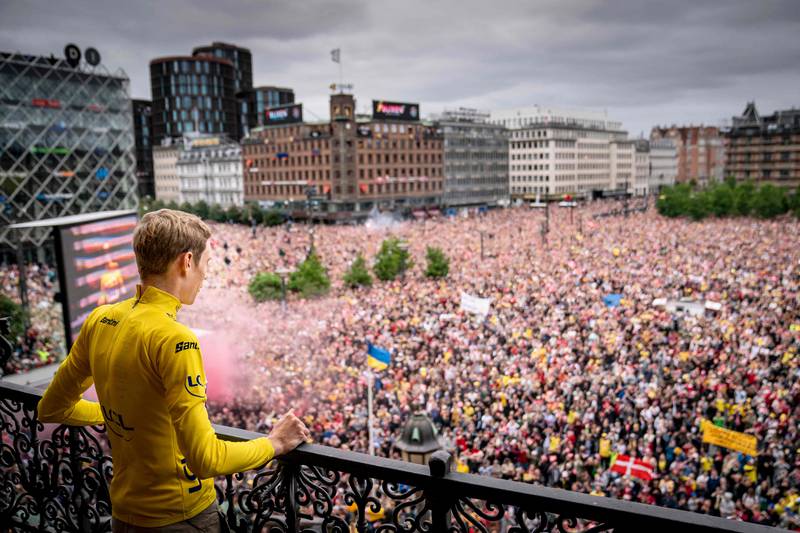 Jumbo-Visma team's Danish rider Jonas Vingegaard, winner of the 2022 Tour de France, reacts as he is welcomed by fans upon arrival at Copenhagen City Hall in Copenhagen on July 27, 2022, a few days after the finish of the Tour de France cycling race in Paris.  (Photo by Mads Claus Rasmussen  /  Ritzau Scanpix  /  AFP)  /  Denmark OUT
