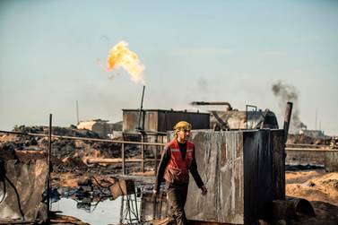 A Syrian worker at a make-shift oil refinery in Al Qahtaniyah, Hasakeh province, on March 11, 2020. AFP