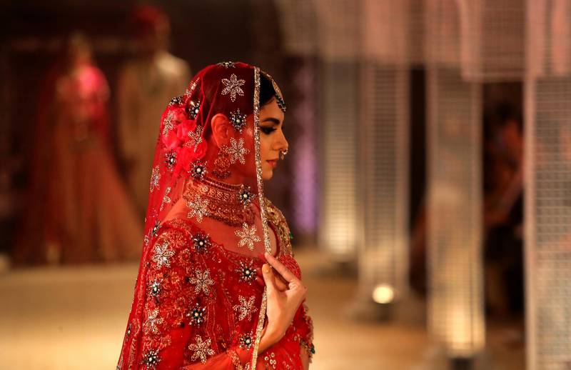 Master designer Tarun Tahiliani went down the traditional route and put his bride in bright red. AP