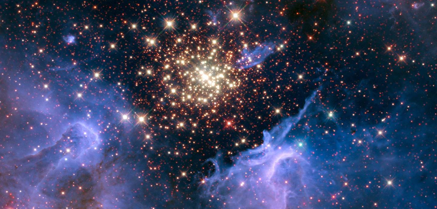 A cluster of young stars resembles an aerial burst, surrounded by clouds of interstellar gas and dust, in nebula NGC 3603 located in the constellation Carina. Nasa / Reuters