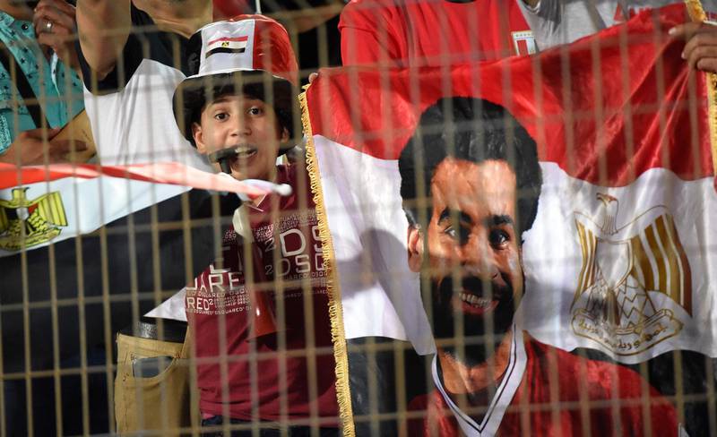Egyptian fans hold a Mohamed Salah flag. Khaled Desouki / AFP