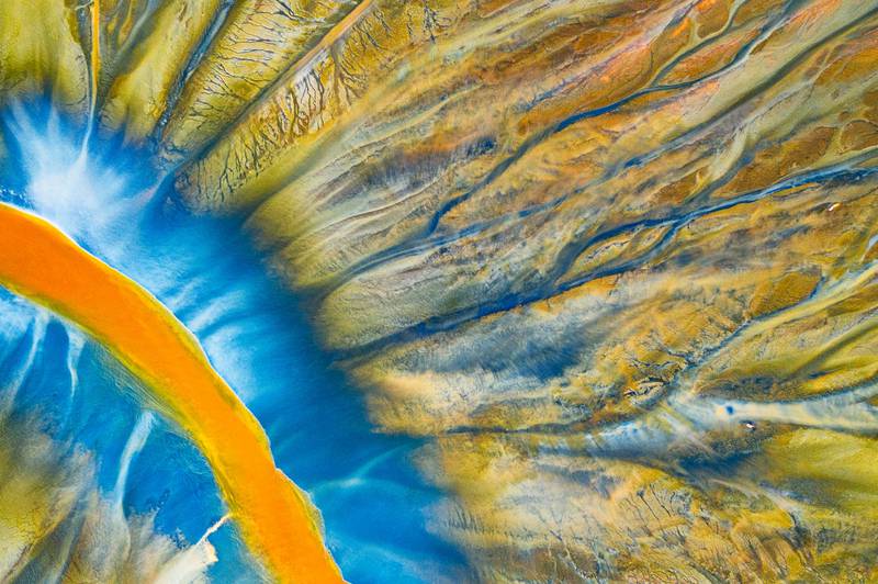 'Poisoned River', Geamana, Transylvania, (Romania), by Gheorghe Popa, first place in the Abstract category. This is a detailed photograph of one of the small rivers filled with poison.