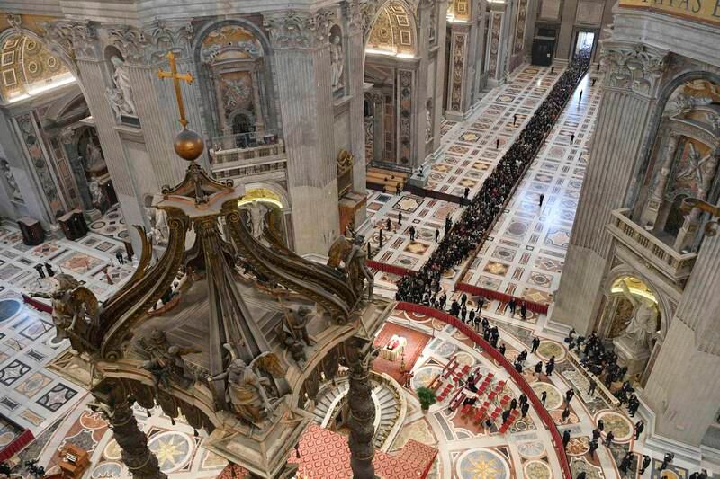 Mourners queue to pay their respects to Pope Emeritus Benedict XVI, whose body lies in state in St Peter's Basilica in Vatican City. EPA