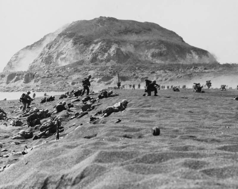 US marines of the Fifth Division move inland off the landing beach after their arrival on Iwo Jima, on February 19, 1945. Reuters