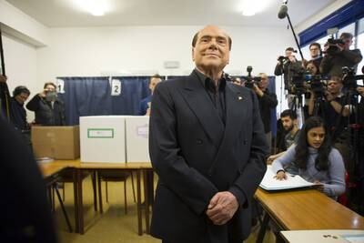 Berlusconi votes at a polling station in Milan in March 2018. Getty