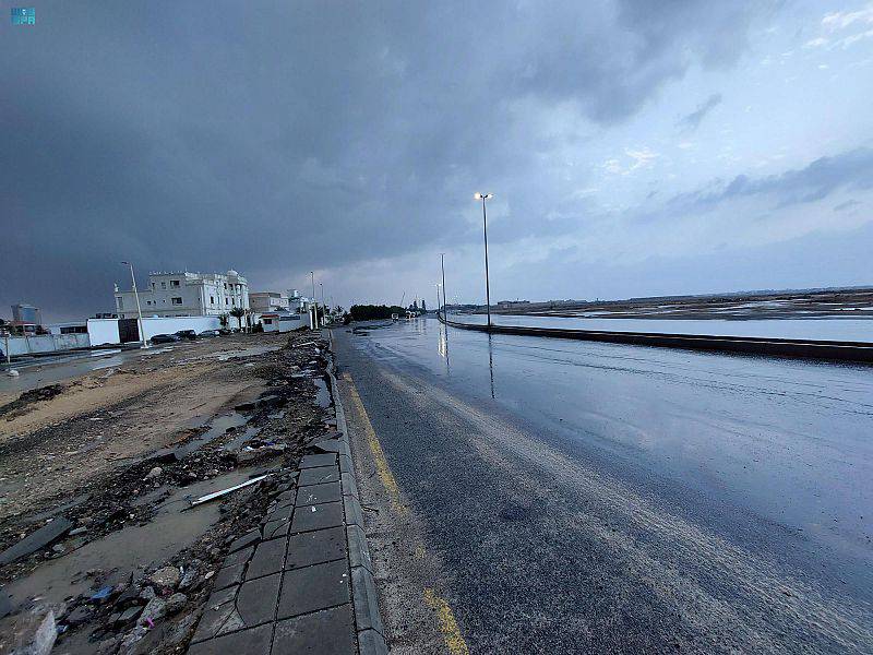A brooding sky and wet road in Jeddah governorate