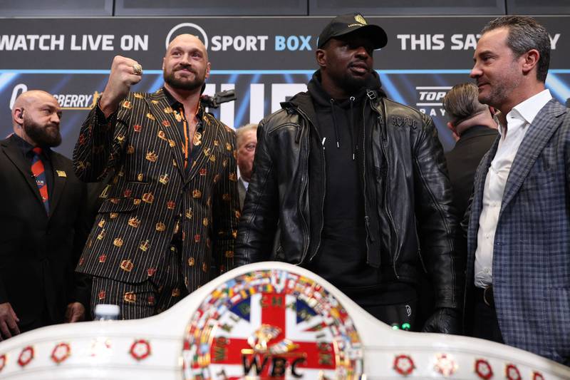Tyson Fury, left, and Dillian Whyte during a pre-fight press conference at the Wembley Stadium in London on Wednesday, on April 20, 2022. Fury defends his WBC heavyweight title in an all-British clash at Wembley on April 23. AFP