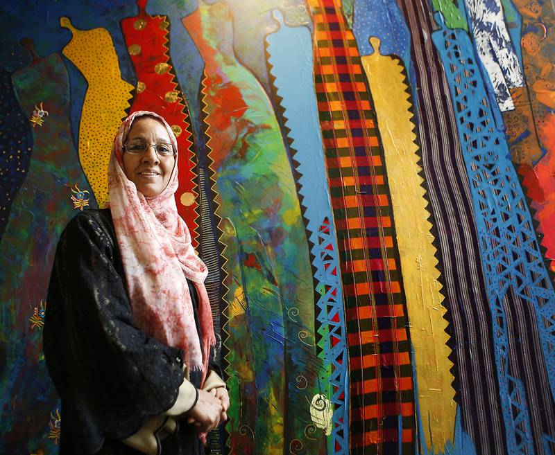 Najat Makki, with her work Illuminant Figures, which is on display in Dubai. Ravindranath K / The National 