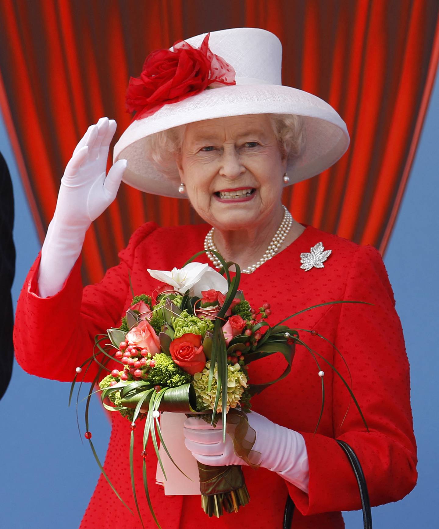 Queen Elizabeth II wears red to attend Canada Day celebrations in Ottawa, Ontario on July 1, 2010. AFP