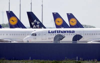FILE PHOTO: Airplanes of German carrier Lufthansa are parked at the Berlin Schoenefeld airport, amid the spread of the coronavirus disease (COVID-19) in Schoenefeld, Germany, May 26, 2020. REUTERS/Fabrizio Bensch/File Photo
