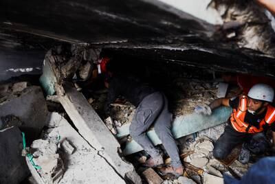 Palestinians in Khan Younis search for casualties under the rubble in the aftermath of Israeli air strikes. Reuters