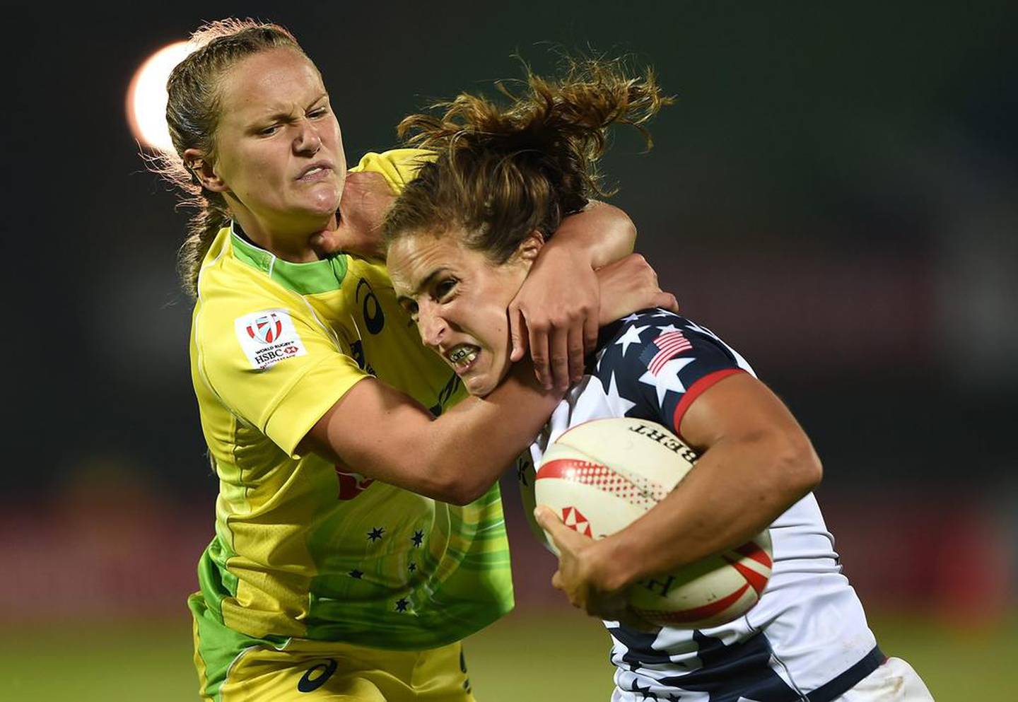Ryan Carlyle of United States and Emma Sykes of Australia battle for the ball in the World Rugby Women’s Sevens in Dubai. Tom Dulat / Getty Images