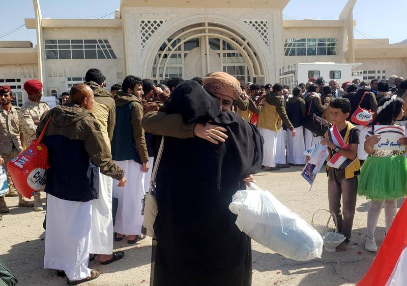A freed Saudi-led coalition prisoner hugs a relative after his release in a prisoner swap, at Sayoun airport, Yemen October 15, 2020. Reuters