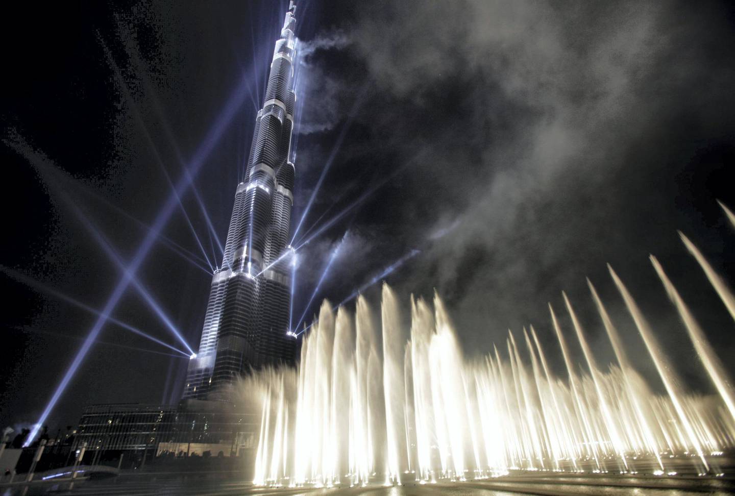 DUBAI, UNITED ARAB EMIRATES - JANUARY 04: 
Laser beams, fireworks and water fountain were displayed during the Burj Khalifa tower opening ceremony on January 4, 2010 in Dubai, United Arab Emirates. The tower, designed by Chicago architect Adrian Smith, is the tallest free-standing structure on Earth. (Photo by Kuni Takahashi/Getty Images)