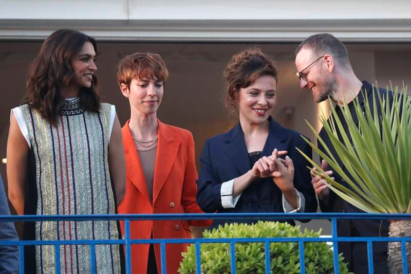 (L-R) Jury members Indian actress Deepika Padukone, British actress Rebecca Hall, Italian actress Jasmine Trinca, and Norwegian film director Joachim Trier pose on the balcony of the Martinez Hotel ahead of the 75th annual Cannes Film Festival, in Cannes, France, 16 May 2022.  The festival runs from 17 to 28 May.   EPA / GUILLAUME HORCAJUELO