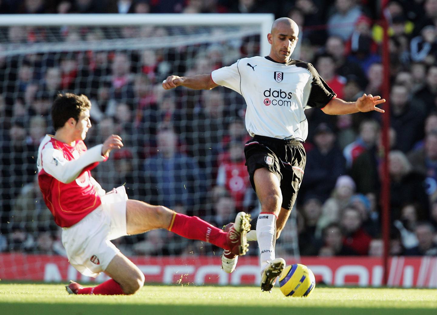 Zesh Rehman, right, playing for Fulham against Arsenal in 2004. Getty