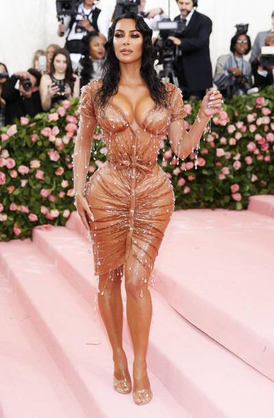 epa07554649 Kim Kardashian poses on the red carpet for the 2019 Met Gala, the annual benefit for the Metropolitian Museum of Art's Costume Institute, in New York, New York, USA, 06 May 2019 (issued 07 May 2019). The event coincides with the Met Costume Institute's new spring 2019 exhibition, 'Camp: Notes on Fashion', which runs from 09 May until 08 September 2019.  EPA-EFE/JUSTIN LANE