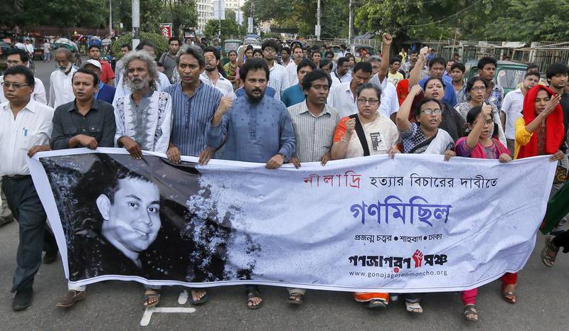 Protestors take to the streets of Dhaka after the murder this month of blogger Niladri Chaterjee, pictured on their banner, who was killed by suspected religious militants over his secular writings.  AM Ahad / AP Photo