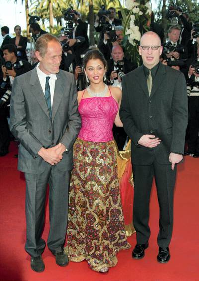 CANNES, FRANCE - MAY 14:   (L-R) Writer Erri De Lucca, actress Aishwarya Rai and director Steven Soderbergh attend the opening ceremony of the 56th International Cannes Film Festival at the Palais de Festival and the premiere of FanFan La Tulipe on May 14, 2003 in Cannes, France. (Photo by Evan Agostini/Getty Images)