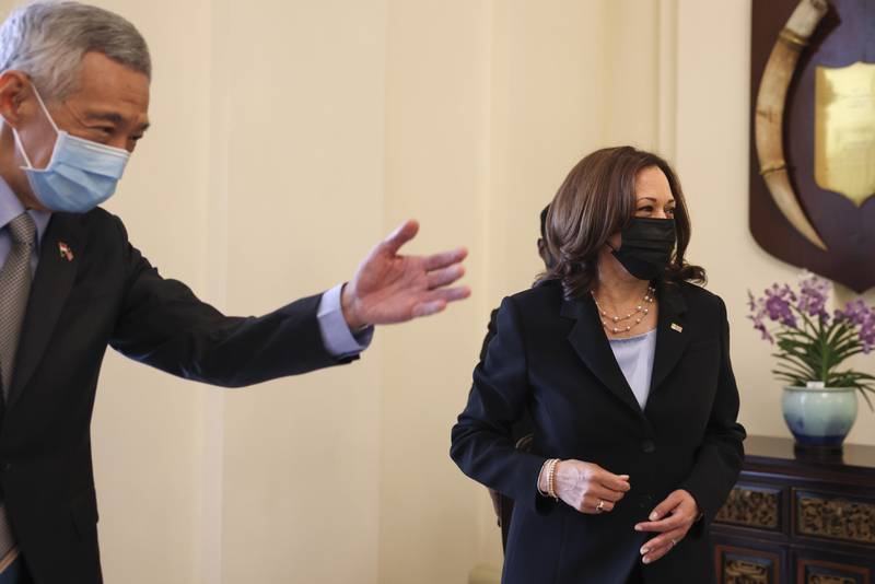 Kamala Harris is welcomed by Singapore's Prime Minister Lee Hsien Loong at the Istana in Singapore on August 23, 2021. AP