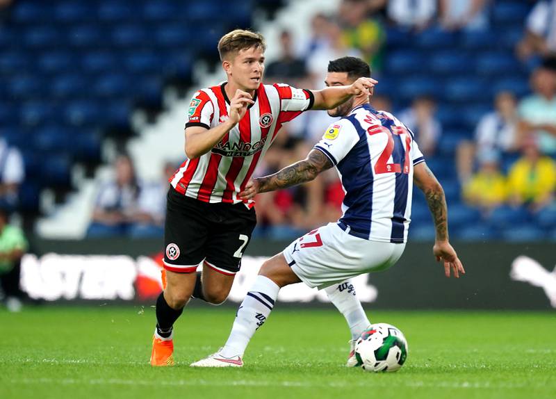Sheffield United's James McAtee and West Bromwich Albion's Alex Mowatt battle for the ball. PA
