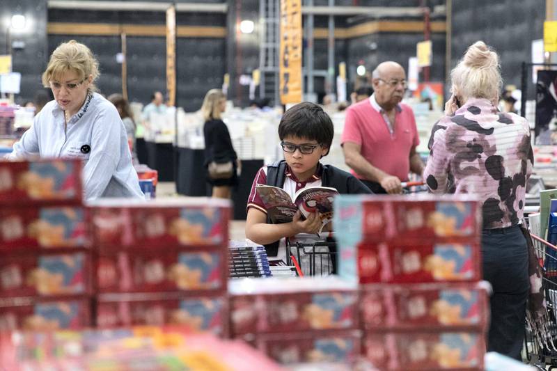 DUBAI, UNITED ARAB EMIRATES - OCTOBER 18, 2018. Shopper browse the books at Big Bad Wolf.The Big Bad Wolf Sale Dubai has over 3 million brand new, English and Arabic books across all genres, from fiction, non-fiction to children's books, offered at 50%-80% discounts.(Photo by Reem Mohammed/The National)Reporter: ANAM RIZVISection:  NA