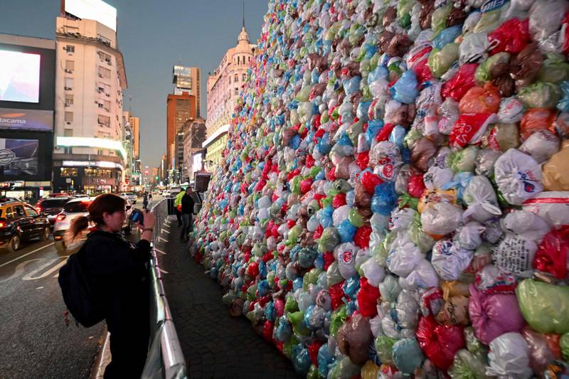 Artists adorn the Obelisk in Buenos Aires with plastic bags to raise awareness on the eve of World Recycling Day. AFP

