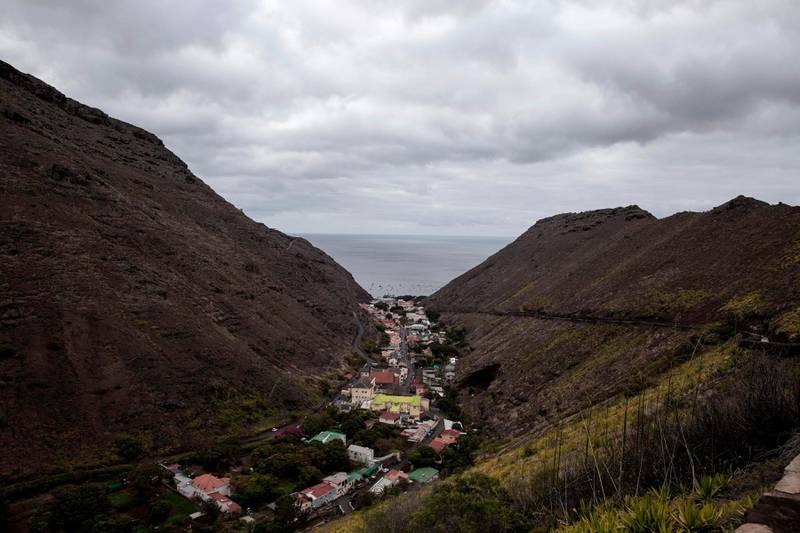 A picture taken on October 14, 2017 shows a general view of Saint Helena's capitol Jamestown on the day of the first inaugural commercial plane from Johannesburg in the volcanic tropical island of Saint Helena, in the South Atlantic Ocean and part of the British Overseas Territory.
After five years of construction, controversy and embarrassing delays due to high winds, an airport built at a cost of ��285 million (318 million euros) will welcome its first routine flight from Johannesburg.  / AFP PHOTO / GIANLUIGI GUERCIA