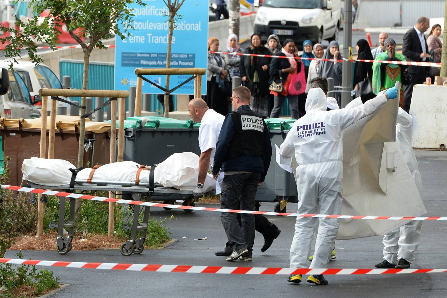 Police remove a body after a man was shot and killed in Marseille, in 2016. Photo: AFP
