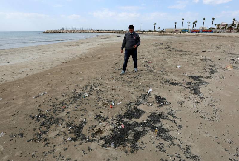 A man walks along a beach in the aftermath of an oil spill in the Mediterranean, in Tyre nature reserve, Lebanon. Reuters