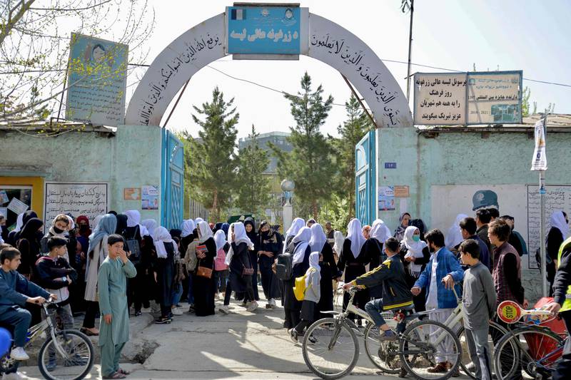 Afghan girls leave their school, which was shut hours after reopening in Kabul on March 23. All photos: AFP