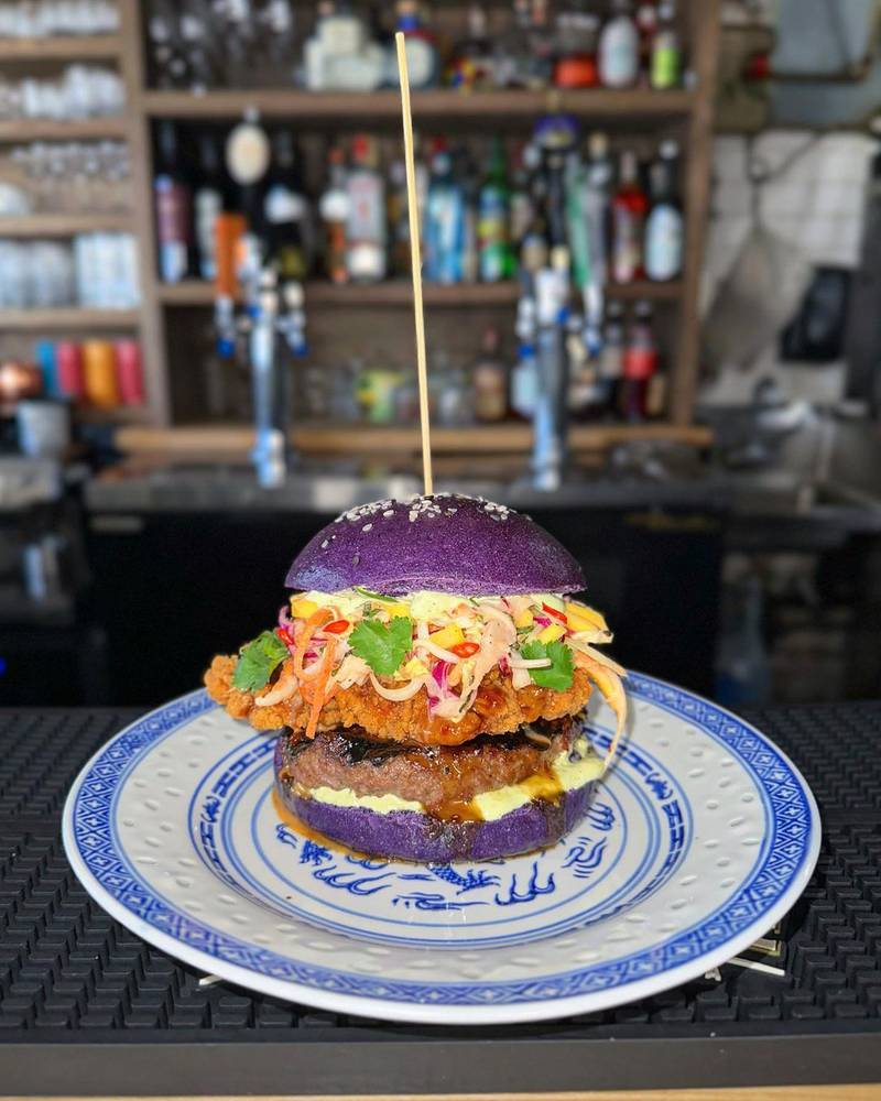 Studio East gastropub in Canada offers a burger with ube steamed buns. Photo: @studioeasthfx / Instagram