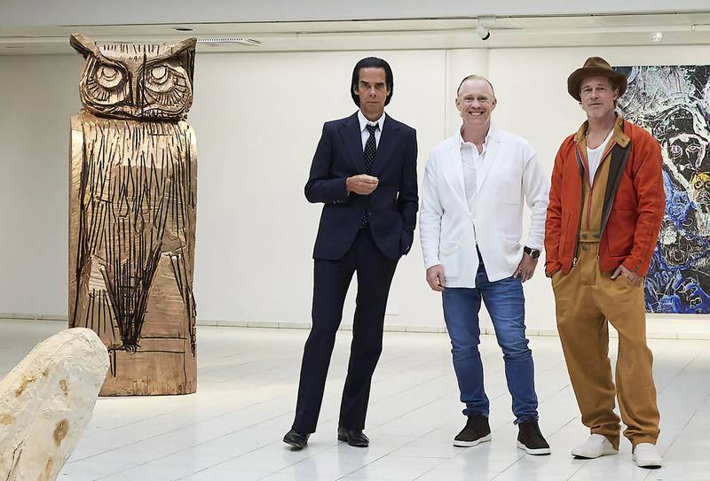 Actor Brad Pitt, right, and musician Nick Cave, left, with British artist Thomas Houseago at the opening of the exhibition 'Thomas Houseago - WE with Nick Cave and Brad Bitt' where Pitt debuted nine sculptures and Cave showed 17 glazed ceramics. AFP