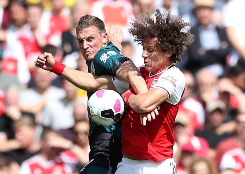 Arsenal's David Luiz in action with Burnley's Chris Wood. Reuters