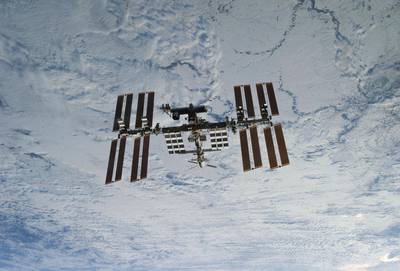 Humans on Earth can sometimes spot the ISS because of its large solar panels. (NASA via AP)