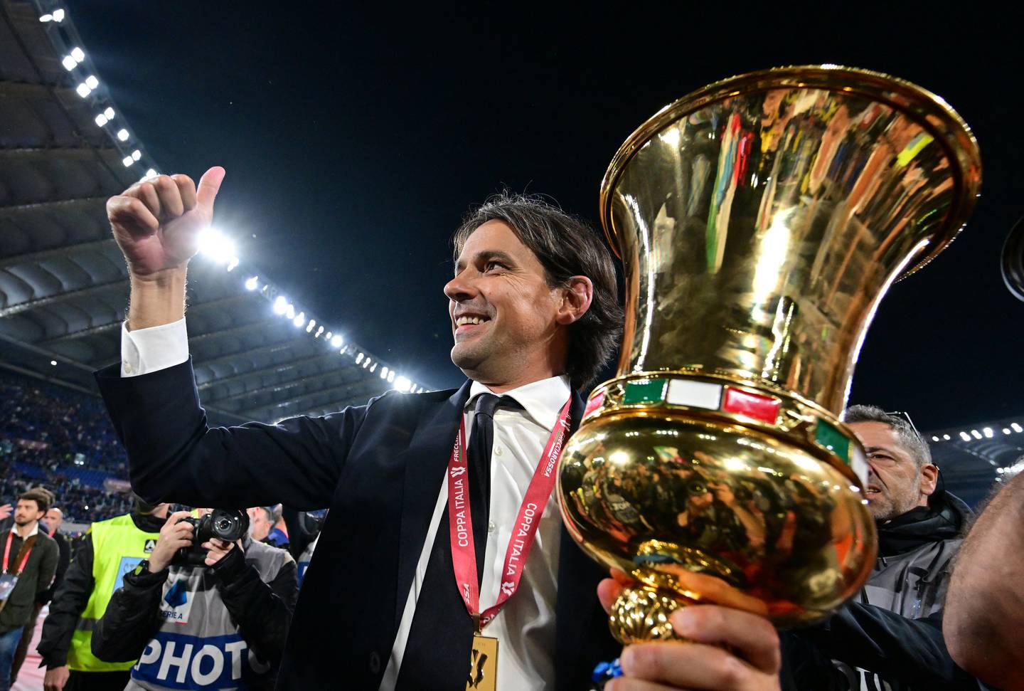 Inter Milan coach Simone Inzaghi celebrates with the Coppa Italia trophy. Reuters