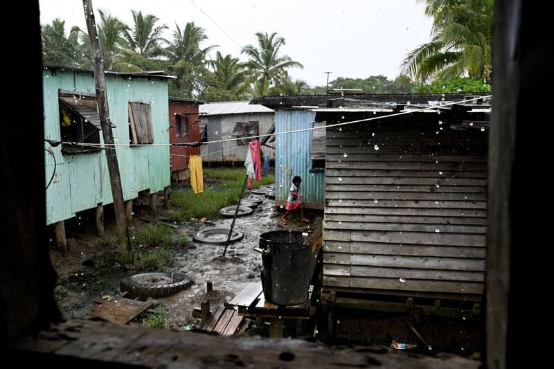 Rain at a settlement near Suva, Fiji, where general elections will be held this week, with the rising cost of living and inequality two of the key issues. EPA