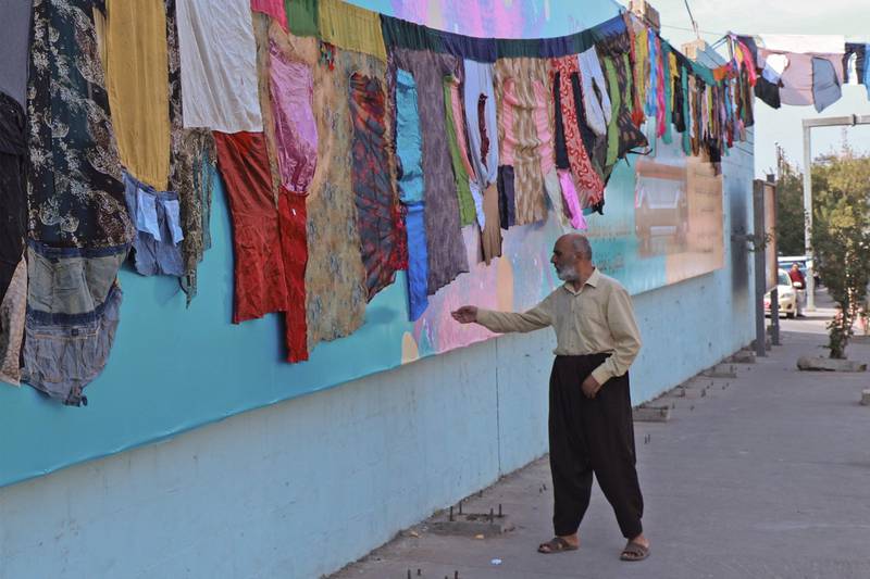 Artwork by visual artist Tara Abdallah in the city of Sulaimaniyah, representing stitched clothes from women who survived domestic violence. AFP
