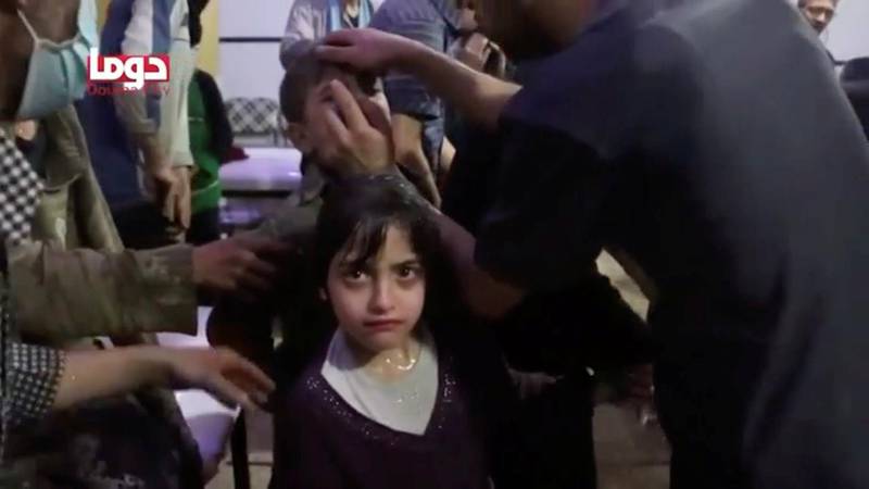 A girl looks on following alleged chemical weapons attack, in what is said to be Douma, Syria in this still image from video obtained by Reuters on April 8, 2018. White Helmets / Reuters TV via Reuters
