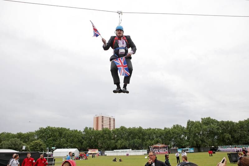 Boris Johnson gets stuck on a zip-line during a BT London Live event in Victoria Park in August 2012. Getty