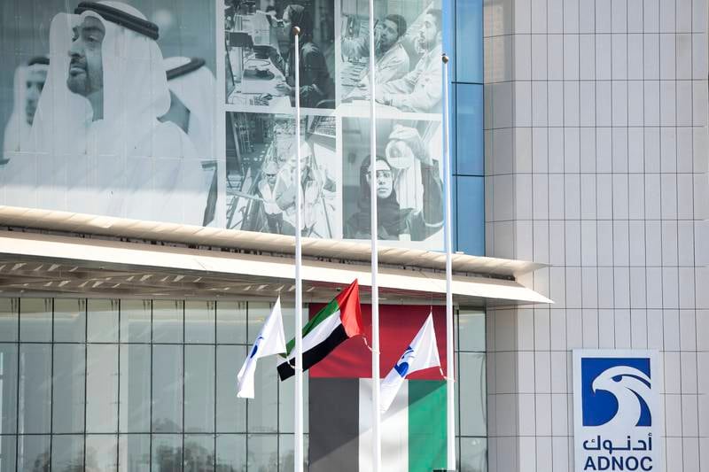 Flags at half-staff outside the ADNOC offices at the Corniche, Abu Dhabi, as the UAE mourns the death of the President, Sheikh Khalifa. Khushnum Bhandari / The National
