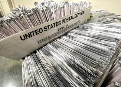 Empty ballots that were mailed by the deadline on election day are processed. Keith Birmingham/The Orange County Register via AP