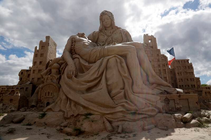 A replica of Michelangelo's sculpture 'Pieta (The Pity)', made by Latvian artists Karlis Ile and Maija Ile. Seventeen professional sculptors from 10 countries have transformed sand into sculptures in an exhibition open to visitors all summer.   