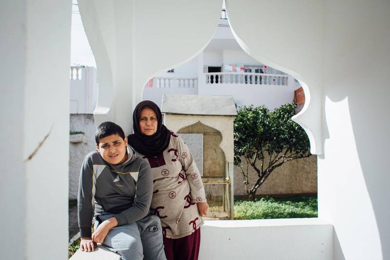 During COVID, Najia, who works as a housekeeper, went months without the income she uses to supplement her children's education, including her 12-year-old son Lofti. Erin Clare Brown / The National
