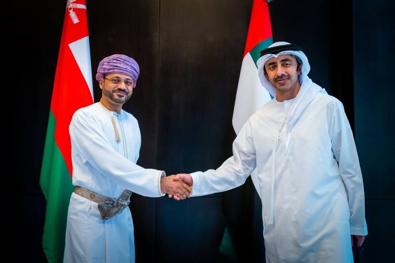 Sheikh Abdullah bin Zayed, Minister of Foreign Affairs and International Co-operation, greets Sayyid Badr Al Busaidi, Oman's Minister of Foreign Affairs, on December 4, 2021. Photo: Wam